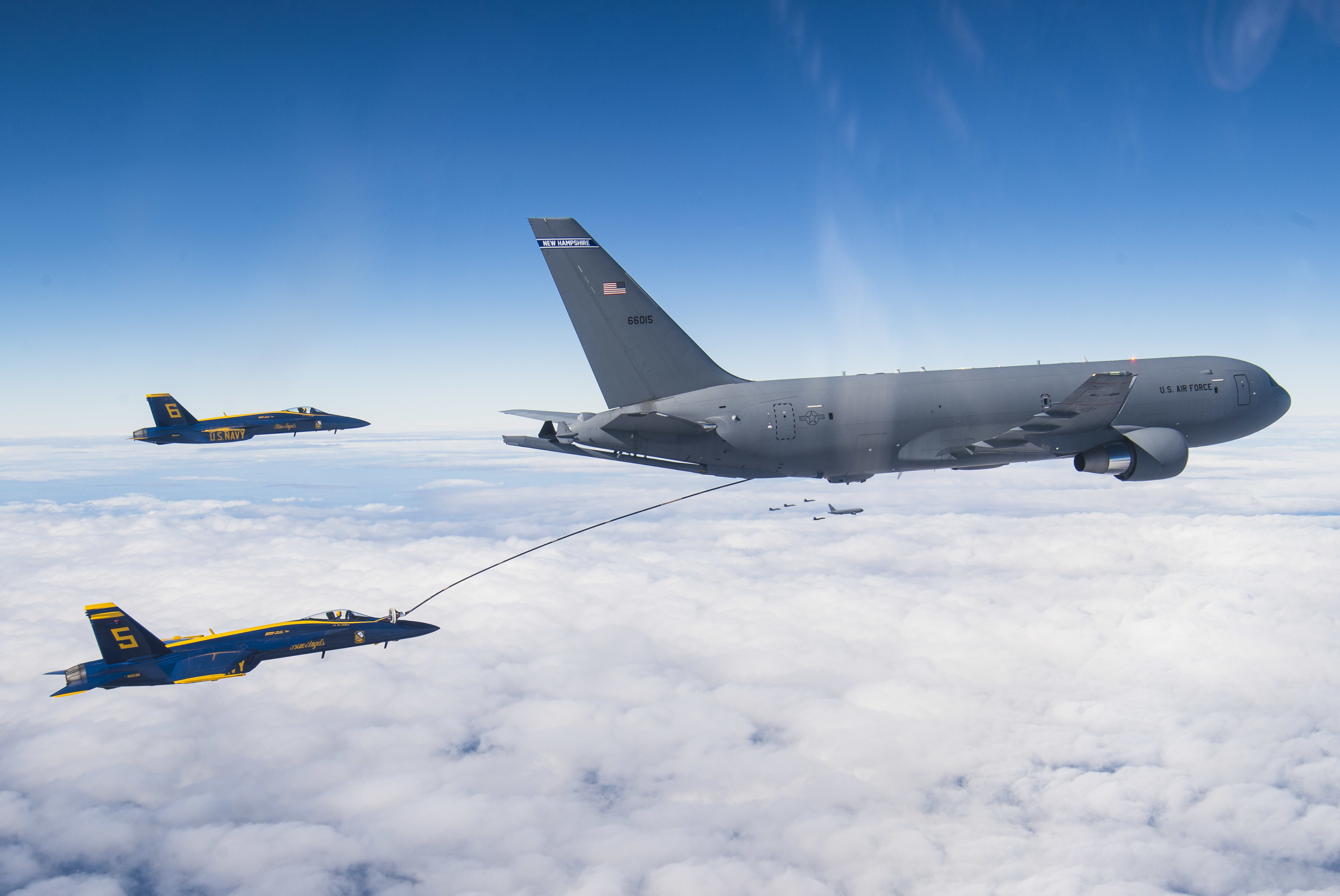 Image of KC-135 air refueling tanker providing fuel to a F-16 fighter plane